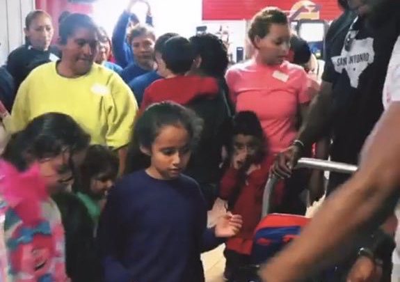 Josh gives out backpacks to children released from detention centers